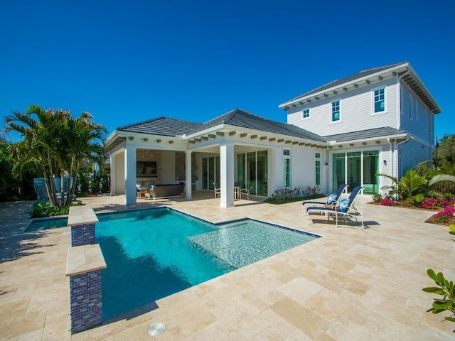 909 Surfsedge Way, Vero Beach, FL 32963 - rear view of house featuring a patio and an outdoor pool