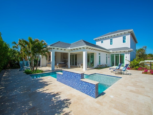 rear view of house with a patio area