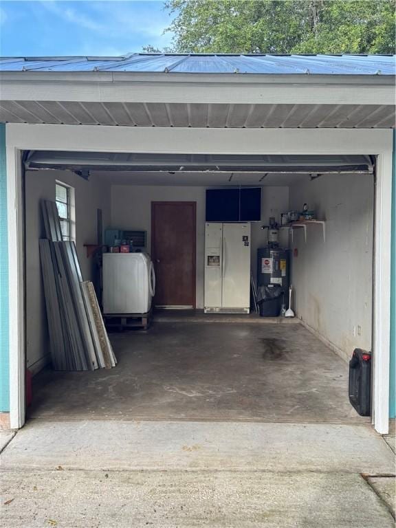 2380 89th Ave, Vero Beach, FL 32966 - garage featuring white fridge with ice dispenser, independent washer and dryer, and gas water heater