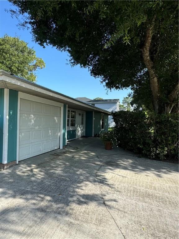 2380 89th Ave, Vero Beach, FL 32966 - view of front of property featuring an attached garage and driveway