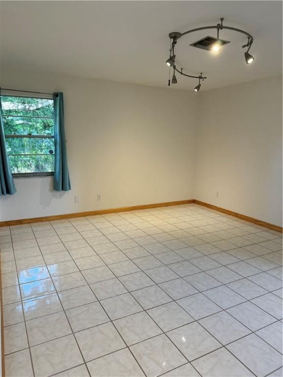 2380 89th Ave, Vero Beach, FL 32966 - empty room with rail lighting and baseboards