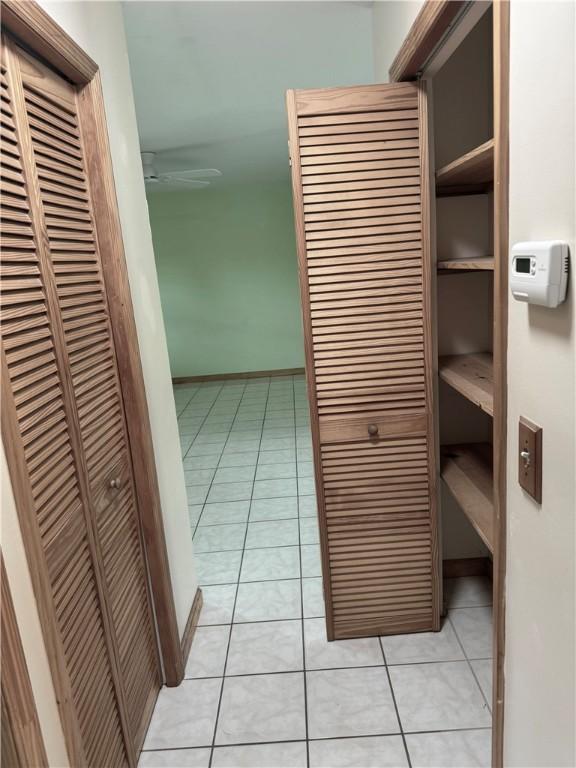 2380 89th Ave, Vero Beach, FL 32966 - hallway with light tile patterned floors