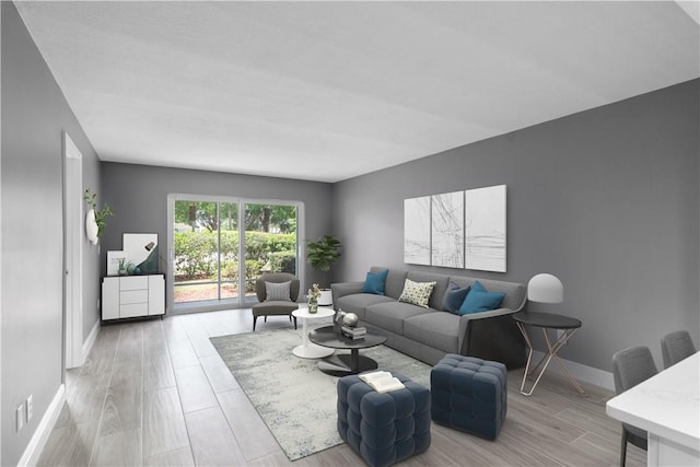 living room featuring baseboards and light wood-type flooring