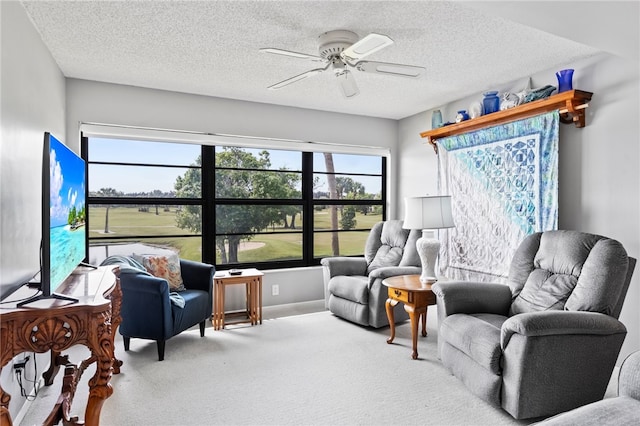 sunroom featuring ceiling fan