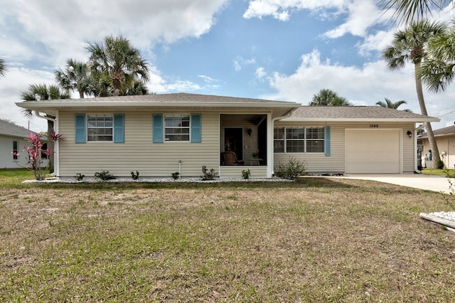 ranch-style house with a garage and a front lawn