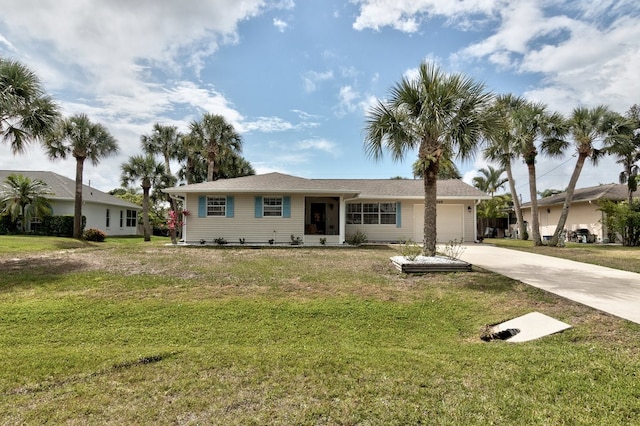 ranch-style home featuring a garage and a front lawn