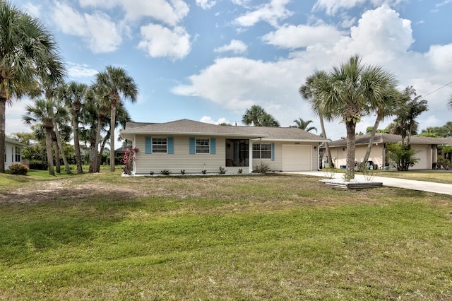 ranch-style house featuring a garage and a front lawn