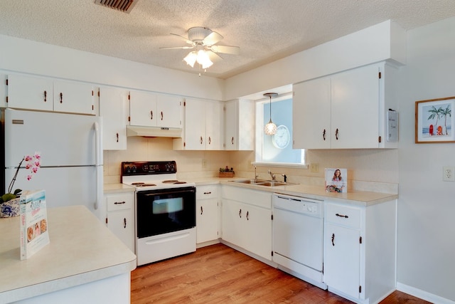 kitchen with ceiling fan, light hardwood / wood-style floors, a textured ceiling, white appliances, and white cabinets