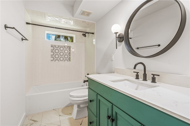 full bathroom with vanity, tiled shower / bath, and toilet