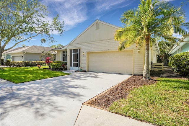 single story home featuring a garage and a front lawn