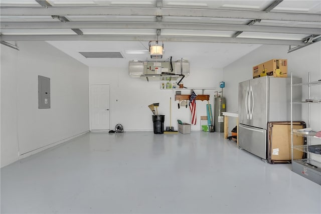 garage with electric water heater, electric panel, stainless steel refrigerator, and a garage door opener