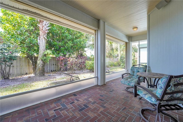 unfurnished sunroom with a healthy amount of sunlight