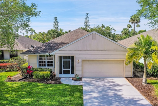 ranch-style home featuring a garage and a front lawn