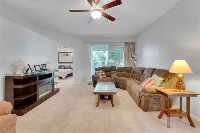 living room featuring ceiling fan and light carpet