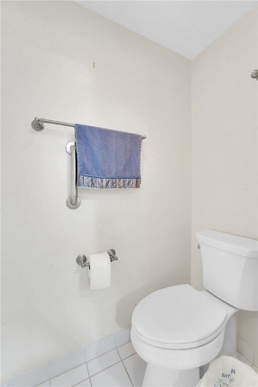 bathroom with tile patterned flooring and toilet