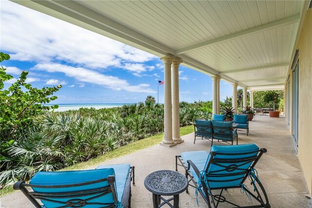 596 Ocean Rd, Vero Beach, FL 32963 - view of patio with a water view and covered porch