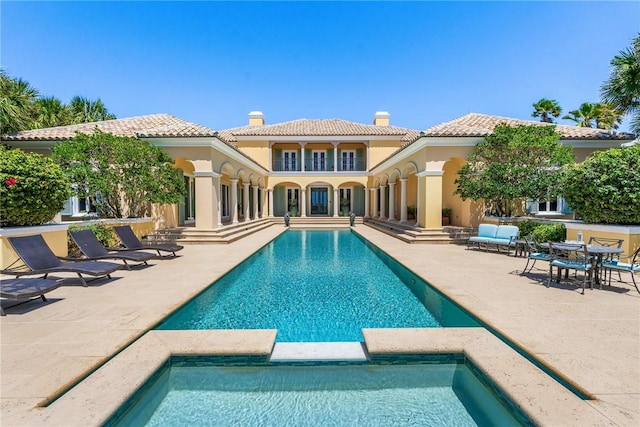 596 Ocean Rd, Vero Beach, FL 32963 - view of pool with a pool with connected hot tub and a patio area