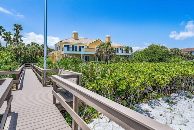 596 Ocean Rd, Vero Beach, FL 32963 - rear view of house with a chimney