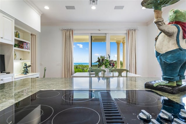 596 Ocean Rd, Vero Beach, FL 32963 - dining space with ornamental molding and recessed lighting