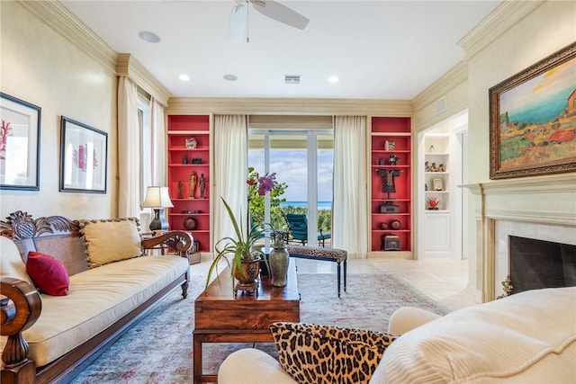 596 Ocean Rd, Vero Beach, FL 32963 - living room featuring built in shelves, ornamental molding, ceiling fan, recessed lighting, and a premium fireplace