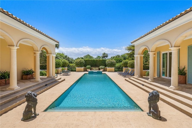 596 Ocean Rd, Vero Beach, FL 32963 - view of swimming pool with a patio area and a pool with connected hot tub