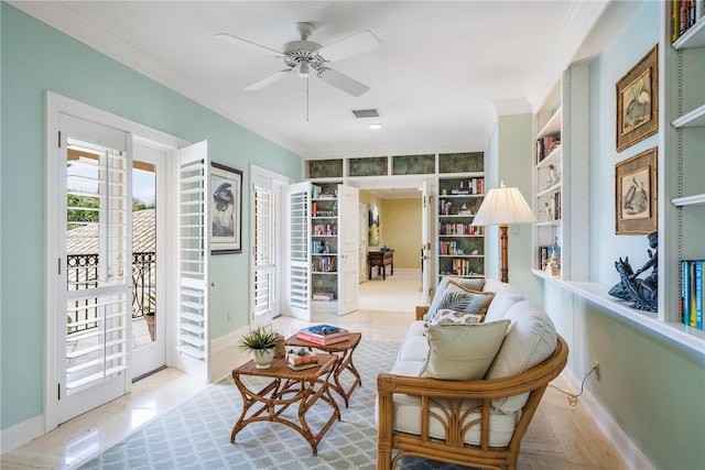 596 Ocean Rd, Vero Beach, FL 32963 - living area featuring ornamental molding, ceiling fan, baseboards, wood finished floors, and built in features