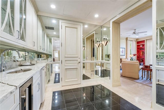 596 Ocean Rd, Vero Beach, FL 32963 - bathroom featuring a sink, wine cooler, a ceiling fan, and granite tiled floors