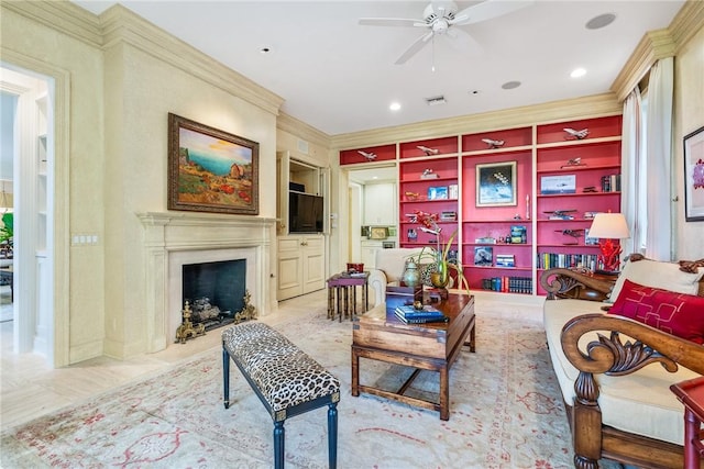596 Ocean Rd, Vero Beach, FL 32963 - living room featuring ceiling fan, a high end fireplace, and crown molding