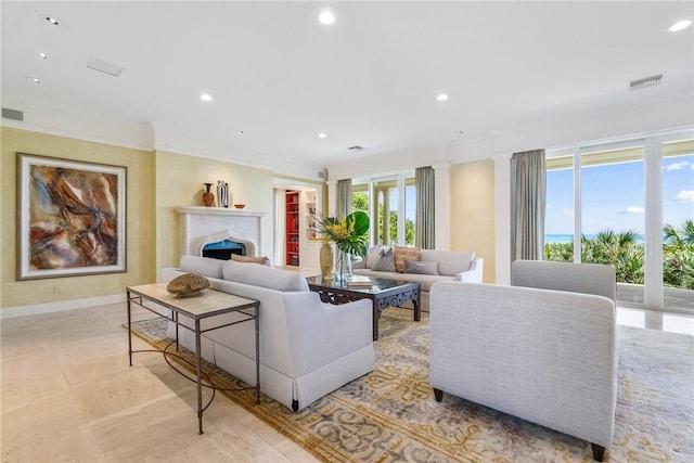 596 Ocean Rd, Vero Beach, FL 32963 - living room featuring recessed lighting, a high end fireplace, crown molding, and baseboards