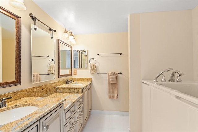 bathroom featuring double vanity, a bathtub, a sink, and tile patterned floors