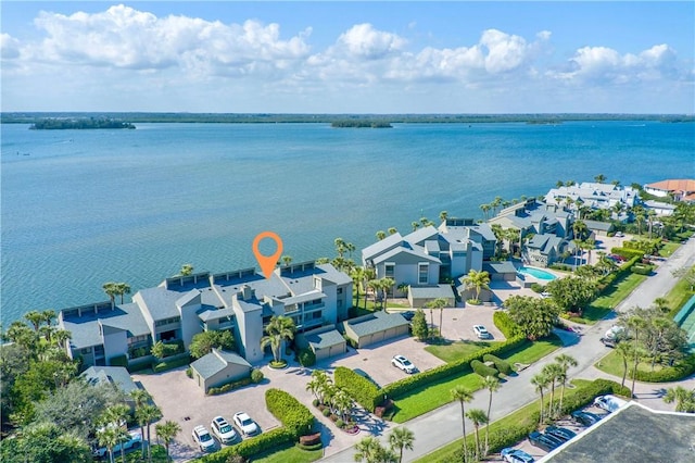 bird's eye view featuring a water view and a residential view