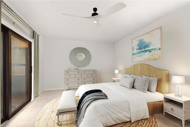 bedroom with light carpet, a textured ceiling, a ceiling fan, and access to exterior