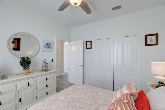 bedroom featuring light hardwood / wood-style flooring, a closet, and ceiling fan