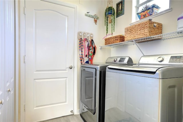 laundry room featuring washing machine and clothes dryer