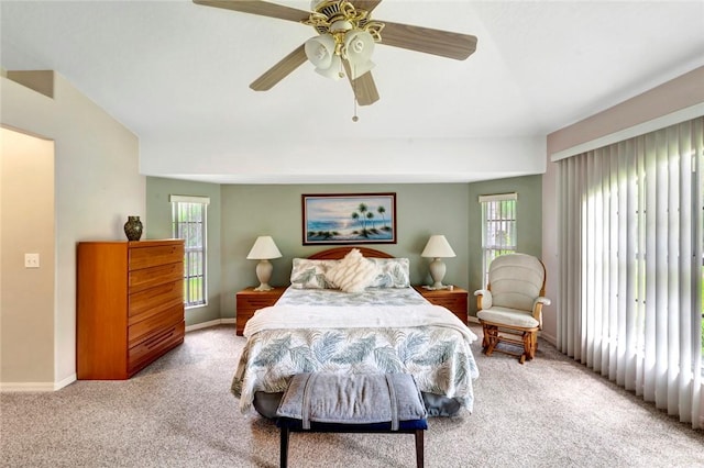 8145 95th Ct, Vero Beach, FL 32967 - carpeted bedroom featuring a ceiling fan, baseboards, and multiple windows