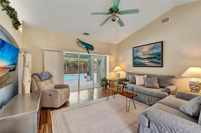 8145 95th Ct, Vero Beach, FL 32967 - living area featuring lofted ceiling, visible vents, ceiling fan, and wood finished floors