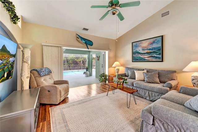 8145 95th Ct, Vero Beach, FL 32967 - living area featuring lofted ceiling, wood finished floors, ceiling fan, and visible vents