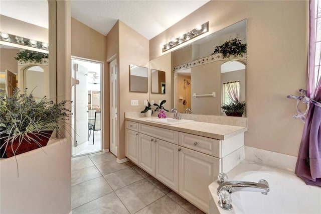 8145 95th Ct, Vero Beach, FL 32967 - bathroom featuring tile patterned floors, a bath, and vanity