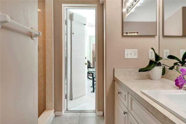 8145 95th Ct, Vero Beach, FL 32967 - bathroom with vanity, tiled shower, and tile patterned floors