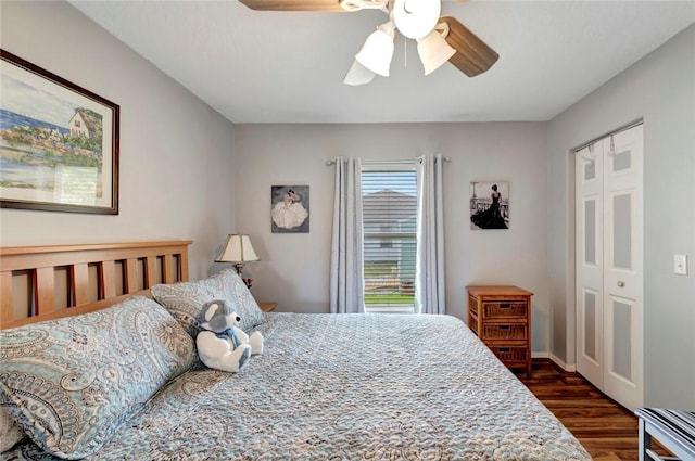 8145 95th Ct, Vero Beach, FL 32967 - bedroom with a ceiling fan, dark wood-style floors, and baseboards