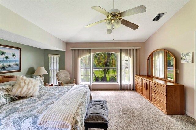8145 95th Ct, Vero Beach, FL 32967 - bedroom with light colored carpet, visible vents, a ceiling fan, and vaulted ceiling