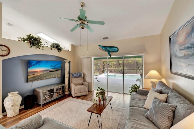 8145 95th Ct, Vero Beach, FL 32967 - living area featuring visible vents, wood finished floors, a ceiling fan, and lofted ceiling