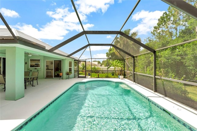 8145 95th Ct, Vero Beach, FL 32967 - outdoor pool with a lanai, a ceiling fan, and a patio area