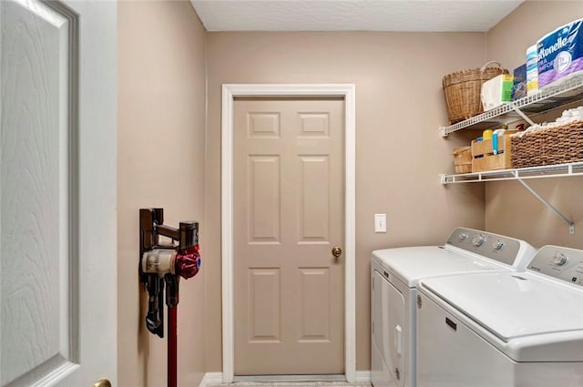 8145 95th Ct, Vero Beach, FL 32967 - clothes washing area with washing machine and dryer, laundry area, and baseboards