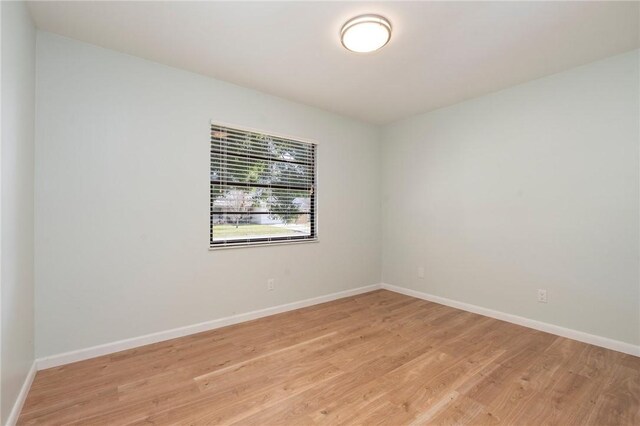 2906 1st St, Vero Beach, FL 32968 - empty room featuring light wood-style flooring and baseboards