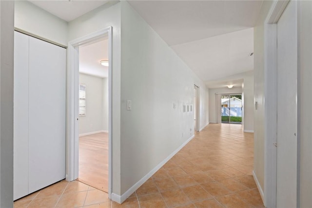 2906 1st St, Vero Beach, FL 32968 - hallway with light tile patterned floors and baseboards