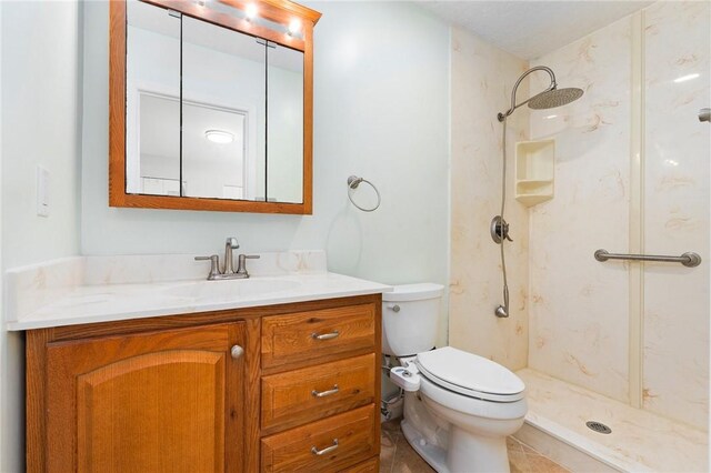 2906 1st St, Vero Beach, FL 32968 - bathroom featuring a shower, vanity, tile patterned flooring, and toilet