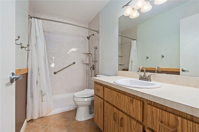 2906 1st St, Vero Beach, FL 32968 - bathroom with toilet, tile patterned floors, vanity, and a shower with shower curtain