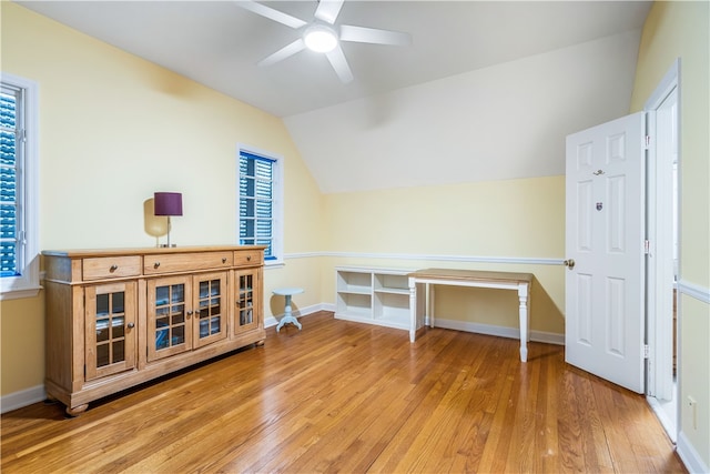 additional living space with hardwood / wood-style floors, ceiling fan, and vaulted ceiling