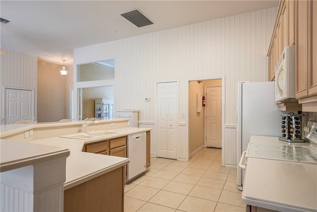 kitchen with white appliances, light brown cabinetry, sink, and light tile patterned flooring